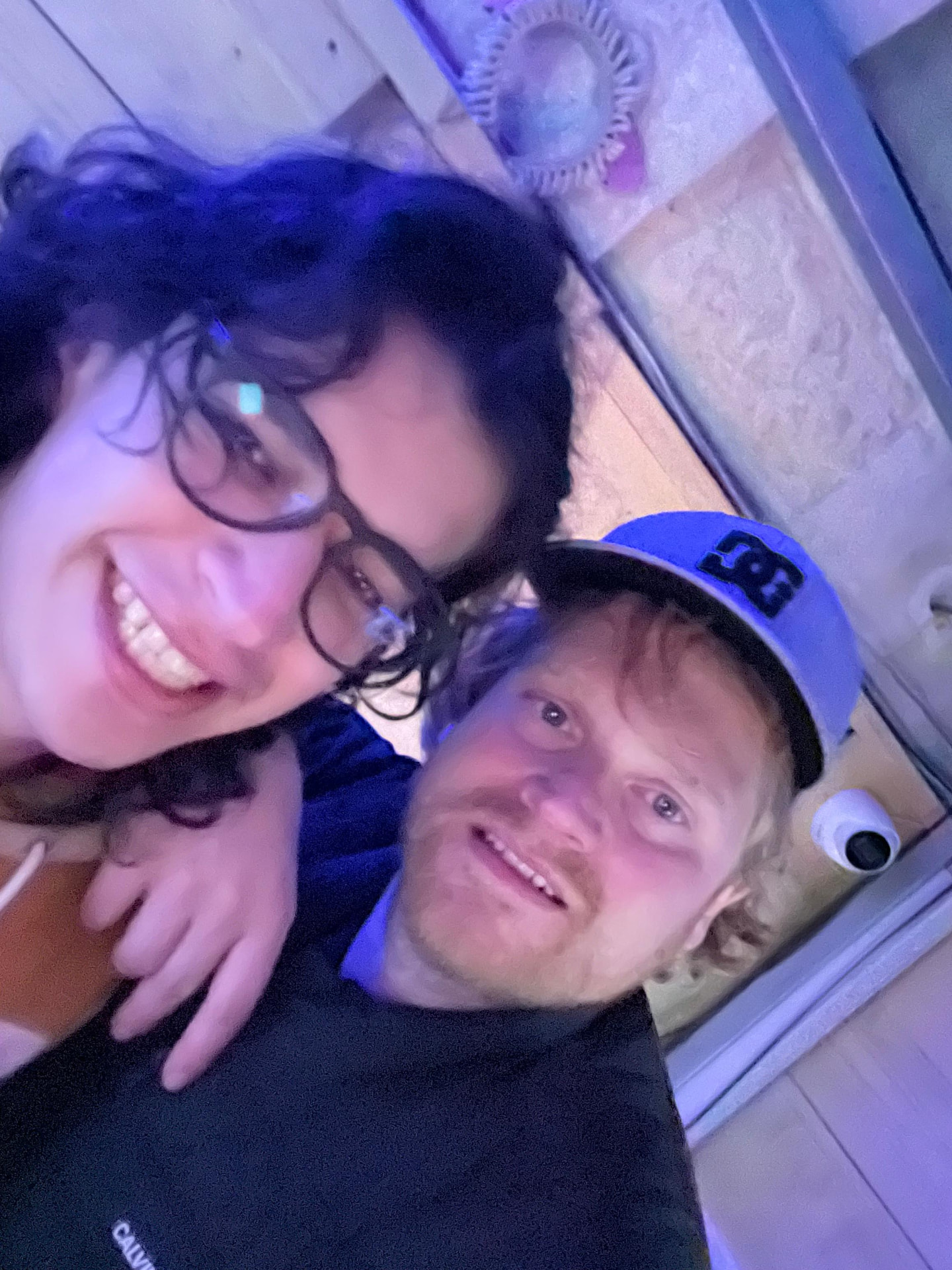 Late-night selfie under the neon — pure Camilo energy.