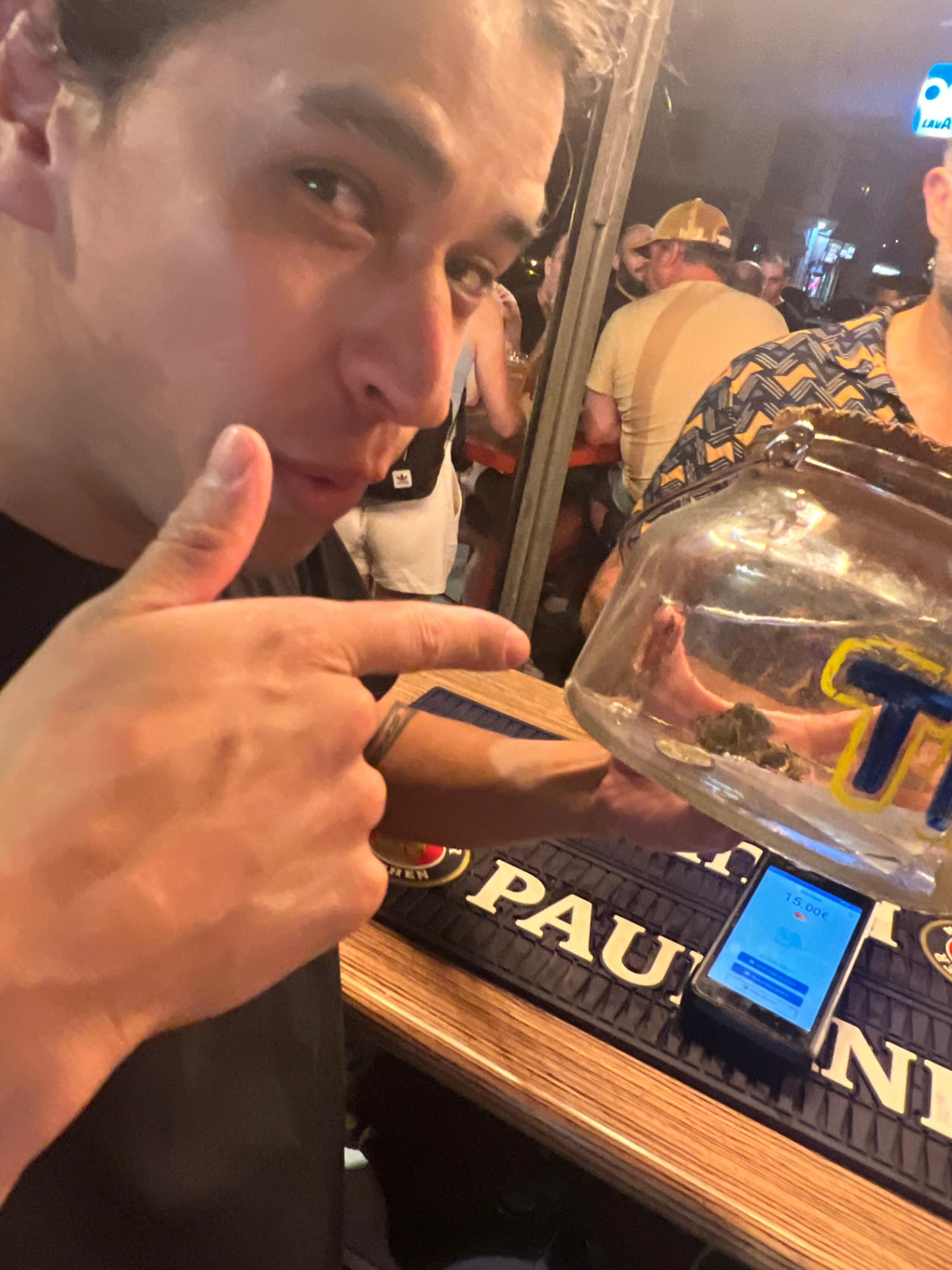 That grin at the bar — Camilo in his natural habitat.