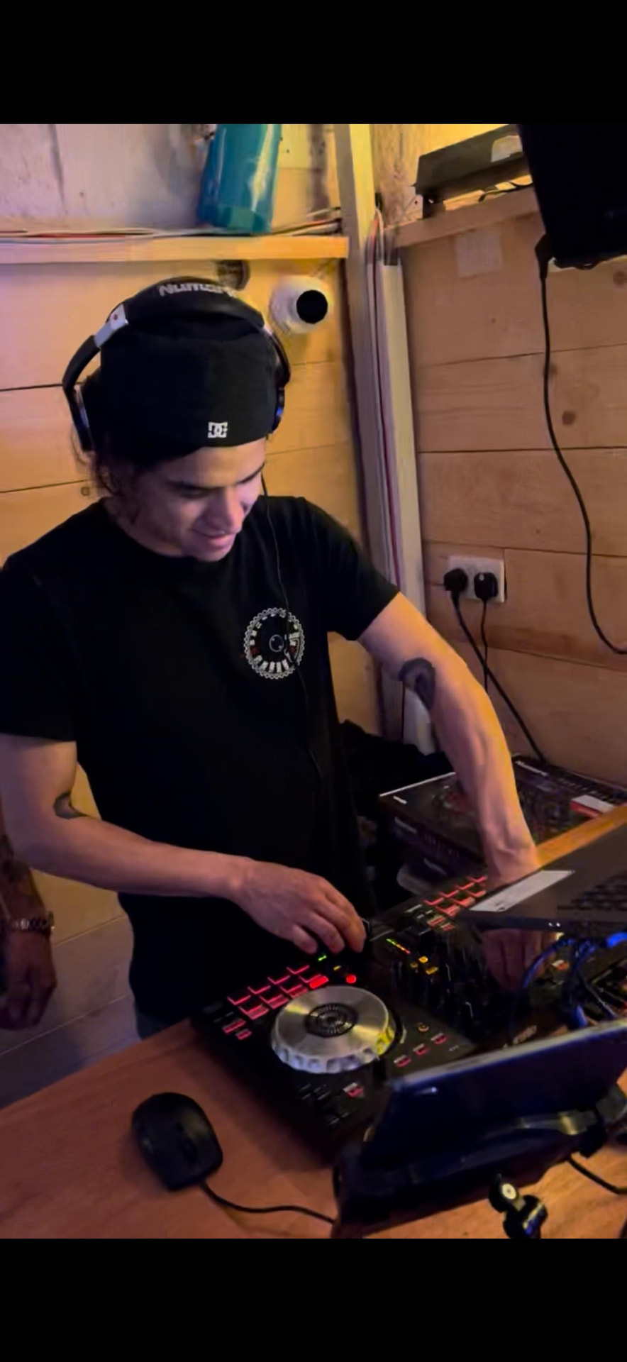 Behind the decks — where Camilo gave our nights their sound.